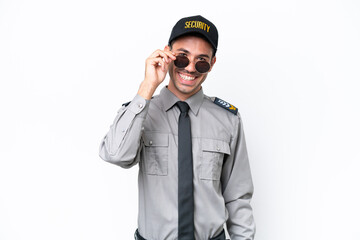 Young safeguard man over isolated white background with glasses and happy