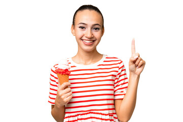 Young Arab woman with a cornet ice cream over isolated background pointing up a great idea