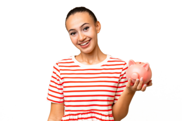 Young Arab woman holding a piggybank over isolated background with surprise and shocked facial expression