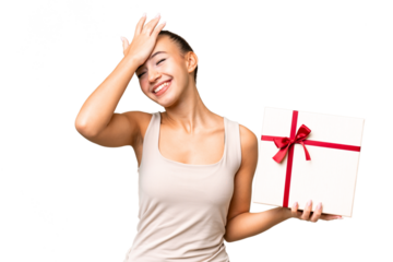 Young Arab woman holding a gift over isolated background has realized something and intending the solution