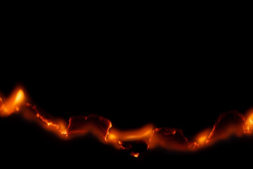 burning paper, glowing edge of paper on a black background