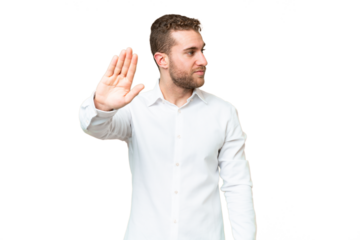 Young handsome blonde man over isolated chroma key background making stop gesture and disappointed