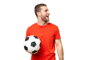 Handsome young football player man over isolated chroma key background laughing in lateral position