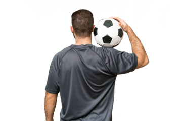 Young handsome blonde man over isolated chroma key background with soccer ball