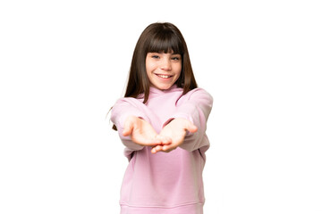 Little girl over isolated green chroma key background holding copyspace imaginary on the palm to...
