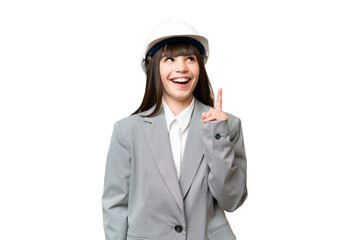 Little girl playing as a architect with helmet and holding blueprints over isolated background thinking an idea pointing the finger up