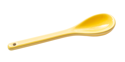 yellow ceramic tea spoon cutout on white background