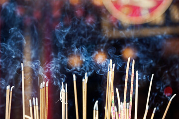 Incense left burning  by worshipers at Wong Tai Sin Temple