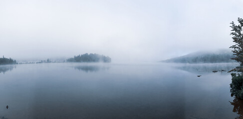Fototapeta premium Mist - Lac Tremblant emerges from the early morning mist