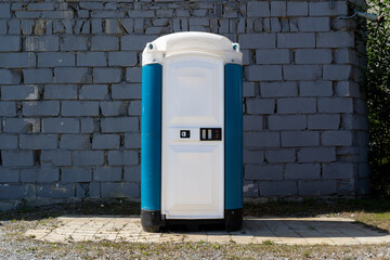 Portable mobile toilet. Temporary restroom, sanitation facility.