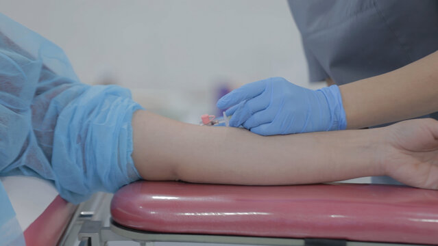 Patient in a hospital receiving an intramuscular injection.