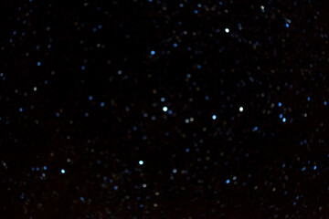 Rain bokeh on a black background. Bokeh of lights made by raindrops on a windows. Website Social Media Banner Poster