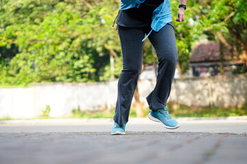 Side view of a jogger legs running. Workout and healthy life concept