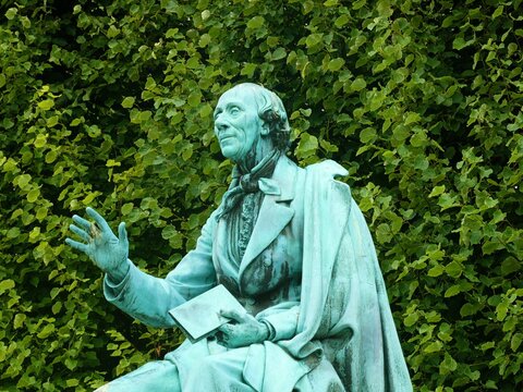 Copenhagen King's Garden (Kongens Have) public park: detail of bronze statue of Hans Christian Andersen with book in hand, by August V. Saabye in 1880