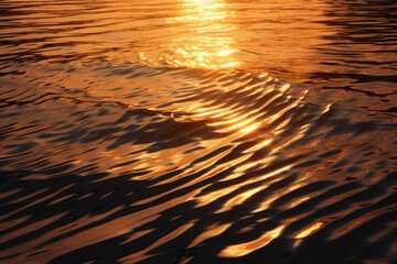 Ripples on the ocean surface at sunset. Small golden waves at sea landscape.
