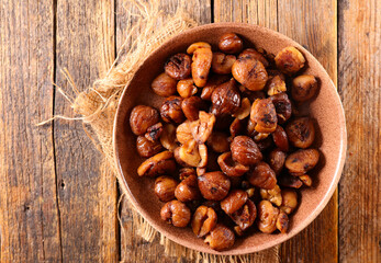 grilled chestnut on wood background