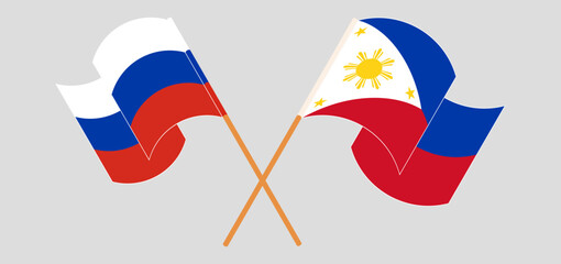 Crossed and waving flags of Russia and the Philippines
