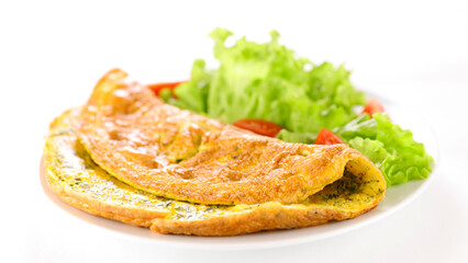 plate with omelette and salad on white background