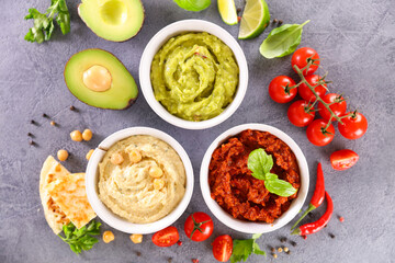 assorted of dipping sauce, various of hummus- healthy party