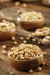 DRİED NUTS AND FRUİTS IN WOODEN BOWL ON BROWN FLOOR