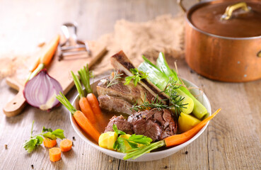 beef stew with vegetables and broth- Pot au feu, French gastronomy