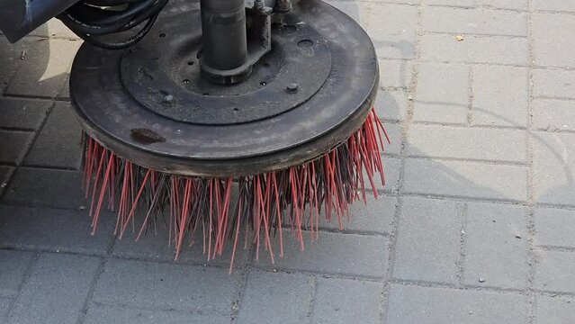 Broom of Road Sweeper Car Machine Close-up. Concept clean streets from debris.

