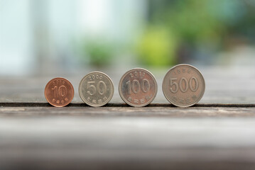 Korean coins placed on a wooden table