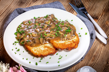 Crispy potato pancakes with mushroom sauce