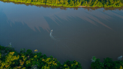 AMAZON FORESTS THAT ARE FLOODED BY THE WATERS OF SURROUNDING RIVERS, THE RIVERS FORM ROUTES FOR...