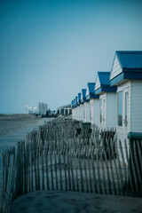 beach huts at dusk