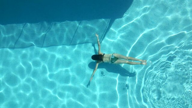 Girl swims underwater 3