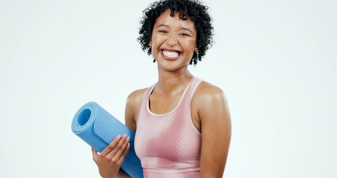 Woman, face and laughing, yoga and fitness with exercise mat, funny and happiness isolated on white background. Workout, training and comedy, yogi and wellness with health and pilates in a studio