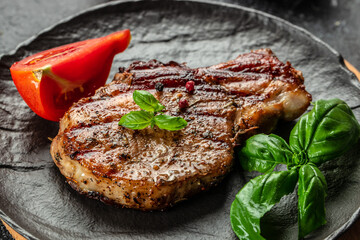 Grilled pork steak on plate. Food recipe background. Close up