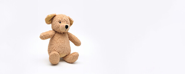 Fototapeta premium Teddybär auf weißen Hintergrund in Querformat für Banner und Hintergrundmotiv, ai generativ