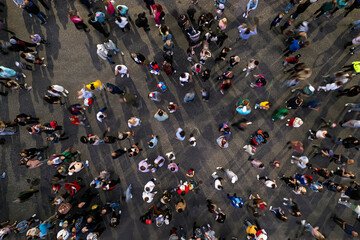 crowd people background. An aerial shot of the people gathered for an event. Crowed open-air meeting people shot from a height. A mass people gathered to celebrate an event. Open-air night festival. - obrazy, fototapety, plakaty