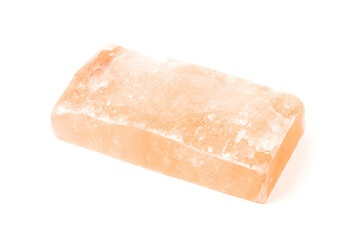 Himalayan salt stone block, crystal of natural pink salt isolated on white background