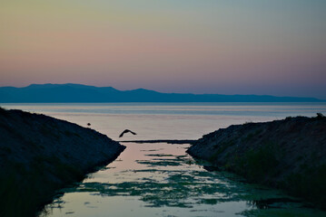 dark sunset silhouette at sea 