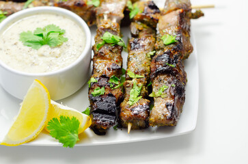 Pork shoulder kebabs with a lemon and herb rub and a garlic and mint yoghurt sauce