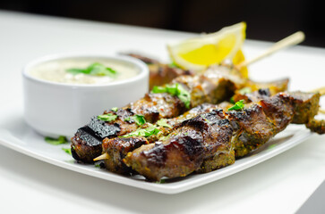 Pork shoulder kebabs with a lemon and herb rub and a garlic and mint yoghurt sauce