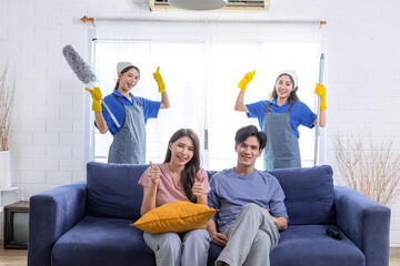 Asian newlywed business people decide to choose professional cleaning service teamwork to clean and...