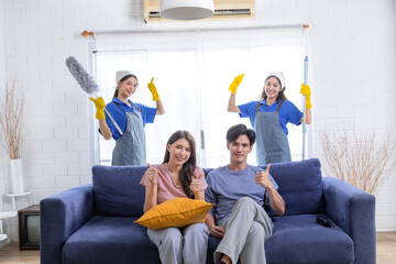 Asian newlywed business people decide to choose professional cleaning service teamwork to clean and...