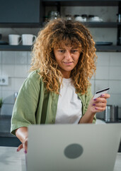 adult woman caucasian female hold credit card online shopping at home
