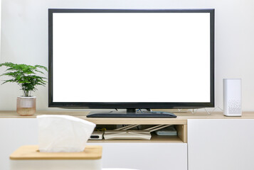 First-person point of view of someone watching TV with white blank television screen and box of tissues blurred in foreground.