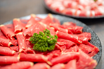 Slice of the fresh raw beef for shabu shabu