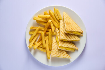 Cheese club sandwiches with french fries on white background, top view