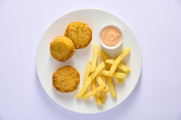 chicken nuggets with french fries, top view on white background