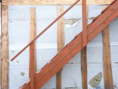 Damaged Vapor Barrier During The Construction Of A Wooden House