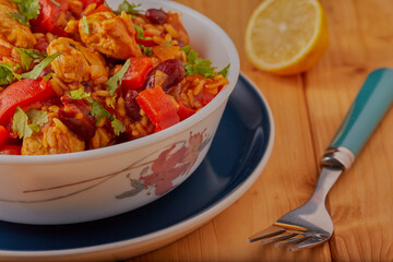 Mexican chicken chilli and rice garnished with coriander.