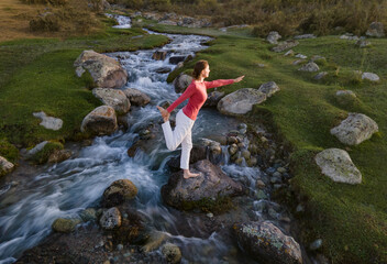 Hand woman yoga and natarajasana pose meditation and relax in the mountan river. Healthy and Zen Concept Close up