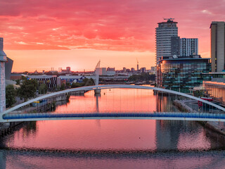  Panoramic view of a beautiful sunset over Millennium Footbridge and Media City Uk BBC Studios. 